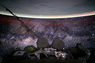 A view of the boundary between outer space and Earth, roughly where the yellow-green line of airglow is visible, as viewed from the International Space Station (ISS). ISS-44 Milky Way.jpg