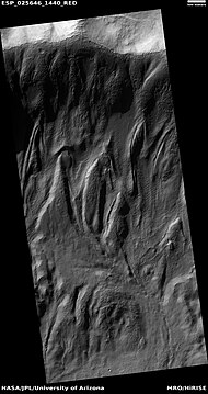 Tongue-shaped flows going down crater wall, as seen by HiRISE