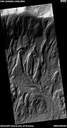 Tongue-shaped flows going down crater wall, as seen by HiRISE