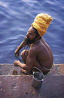 Holy man washing in the Ganges Varanasi Benares India