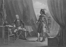 Native American in profile facing left looking at Jackson in military uniform seated, both are in a tent