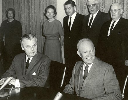 Canadian Prime Minister John Diefenbaker (seated left) and US President Dwight Eisenhower at the signing of the Columbia River Treaty, 1961