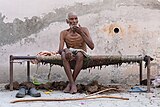 Khairdeen, alias Pritam, sitting on a cot outside his house in Jandali, district Ludhiana, Punjab, India 01.jpg