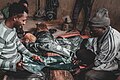 Kofar Mata Dye pit workers beating dye clothes.jpg