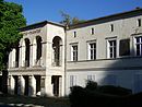 Building of the science and restoration center of the SPSG, formerly the building of the Hans-Otto-Theater, former society house "Zum Alten Fritz" (front building with ticket hall and memorial plaque for the unification party conference of the KPD and SPD of the state of Brandenburg to the SED)