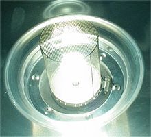 Sulfur lamp inside a Faraday cage, which is necessary to prevent microwave radiation leakage from the magnetron which would cause radio interference Lampa siarkowa.jpg