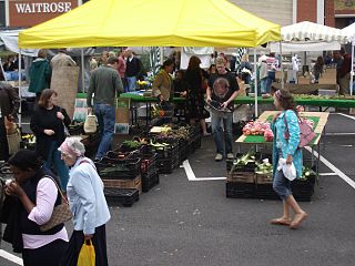 Local food movement of people who prefer to eat foods which are grown or farmed relatively close to the places of sale and preparation
