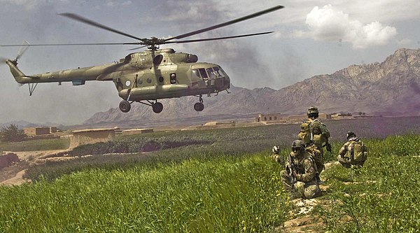 An Mi-17 and troops, Afghanistan, 2009.