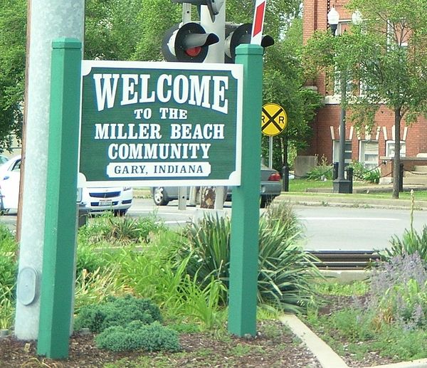 Sign next to Miller Station, welcoming visitors to Miller Beach