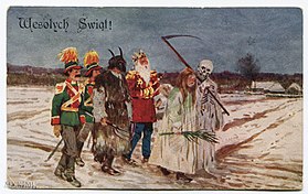 Mummers with a Turon creature singing Christmas carols called koledy in Poland, 1929 postcard Mummers Play in Poland.jpg