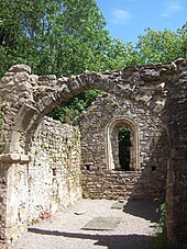 12th-century arch across the chancel Nave of St James church, Lancaut.jpg