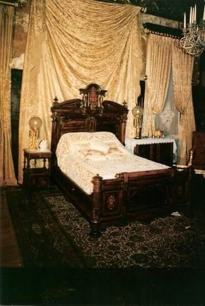 The mansion's dining room staged as a bedroom