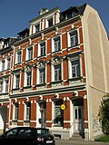 Apartment building in half-open development