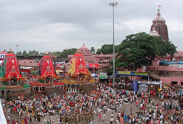 Three chariots of the deities with the Temple in the background, Puri