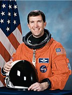 Richard Husband, NASA photo portrait in orange suit.jpg