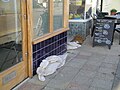 Sandbags outside shop entrances in Monkton Street, Ryde, Isle of Wight. Torrential rain the day before had caused flash flooding to Ryde, with more rain forecast the next day.