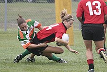 Savannah's Katie Thomen tackling Lauren "Speedy" Buslinger Raleigh Venom vs. Savannah.jpg