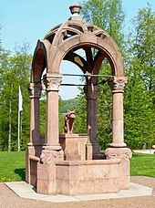 The well in front of the house from which it derives its name Schloss Wolfsbrunn 110428 AMA fec (44).JPG