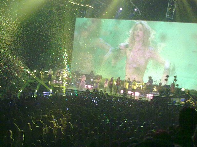 Shakira performing "Waka Waka (This Time for Africa)" during a concert show in Manchester, England