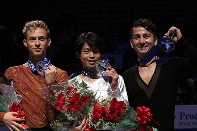 Aaron (right) at the 2013 Skate America podium.