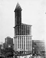 Smith Tower looking north of the completed steel structure of the main building, tower, and cone, showing facade panels for (SEATTLE 4930).jpg
