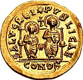 Gold coin showing two figures seated on a throne. Both are nimbate; there is a cross between them. The entire scene is encircled by text.