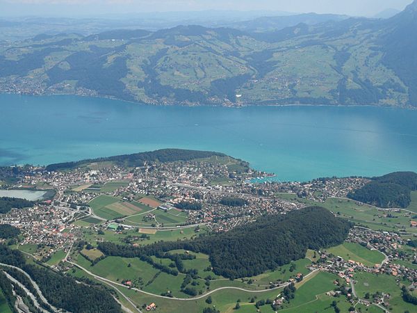 Spiez from the air, with the lake in the background and the Kander bottom left