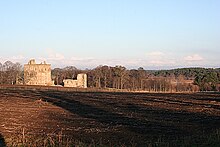 Spynie Palace and the remnants of the drained Loch Spynie, seen from the kirkyard of Holy Trinity Church, Spynie Spynie Palace and Loch from Spynie Kirkyard - geograph.org.uk - 1063054.jpg