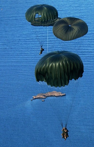 File:US Navy 060506-N-0411D-089 Pararescue jumpers assigned to the U.S. Air Force 304th Expeditionary Rescue Squadron dropped two all-terrain vehicles from an HC-130 and followed them out.jpg