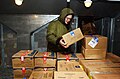 US Navy 070406-N-4009P-039 Wearing a cold weather suit, Aviation Electrician's Mate Airman Fred Hampton, from San Antonio, stacks frozen food in a freezer on board Nimitz-class aircraft carrier USS Ronald Reagan (CVN 76).jpg