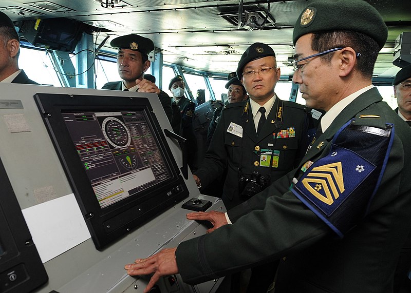 File:US Navy 101109-N-7191M-036 Members of the Japan Ground Self-Defense Force observe navigation equipment on the navigation bridge aboard the aircraft.jpg