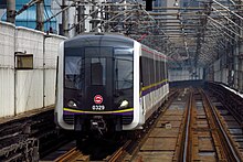 03A02 train entering Caoyang Road (September 2017)