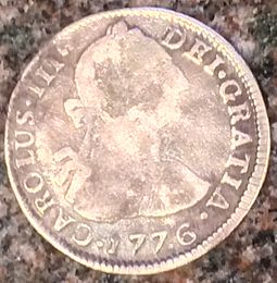 A Spanish colonial two-reales piece ("two bits") from the Potosi Mint (today in Bolivia) 1776 Potosi 2 reales obv.jpg