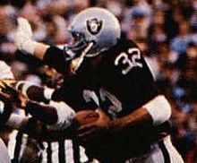 Allen led the Raiders to a championship in Super Bowl XVIII and earned MVP honors as he rushed for a record of 191 yards, including a memorable 74-yard touchdown run. 1986 Jeno's Pizza - 52 - Marcus Allen (Marcus Allen crop).jpg