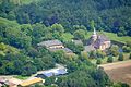 Schloss Sandfort ist ein Wasserschloss in der Bauerschaft Vinnum, Olfen, Kreis Coesfeld, Nordrhein-Westfalen, Deutschland. Das Bild entstand während des Münsterland-Fotoflugs am 1. Juni 2014. Hinweis: Die Aufnahme wurde aus dem Flugzeug durch eine Glasscheibe hindurch fotografiert.