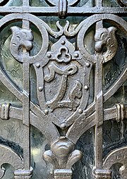 Gothic Revival cartouche with initial on a door of the Vasile Zottu House (Strada C.A. Rosetti no. 7), Bucharest, unknown architect, 1909[19]