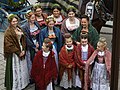 A group of young women and children wearing traditional clothing during the traditional Leonhardi Ritt in the German city of Bad Tölz by Namevergeben123