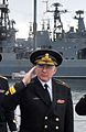 Acting commander of the Russian Northern Fleet rear admiral Andrey Volozhinsky renders a salute, 2011.jpg