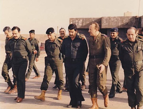 Adnan Khairallah, Iraqi Defense Minister, meeting with Iraqi soldiers during the Iran-Iraq war.