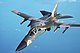 An air-to-air left front view of an F-111 aircraft during a refueling mission over the North Sea DF-ST-89-03609.jpg