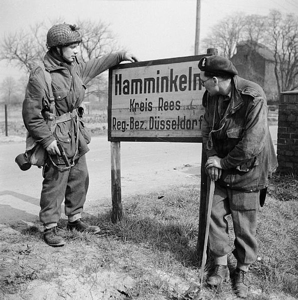 File:British airborne troops study a sign outside Hamminkeln during operations east of the Rhine, 25 March 1945. BU2292.jpg