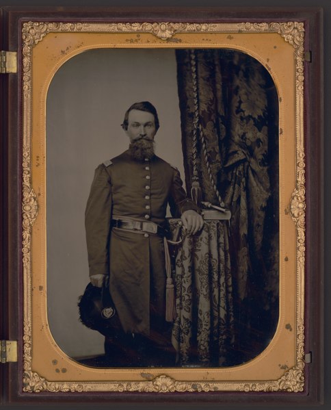 File:Captain John Wilson of Co. C, 8th Kentucky Infantry Regiment (Union), in uniform with sword; revolver and book rest on table LCCN2015645564.tif