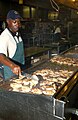 File:Contract worker prepares fried chicken at Guantanamo .jpg