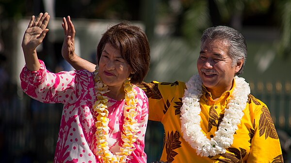 Governor David Ige and First Lady Dawn Ige ride in the Kamehameha Day Parade, 2016