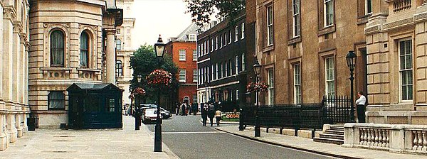 Downing Street looking west. The Foreign and Commonwealth Office is on the left, the red house is No. 12, the dark houses are No. 11 and No. 10 (neare