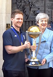 Eoin Morgan holding 2019 World cup trophy with prime minister Theresa May Eoin Morgan, Theresa May.jpg