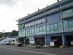 The three-story terminal building, with departures/arrivals on the runway-level, checkin on the street-level and first-floor cafe/lounge