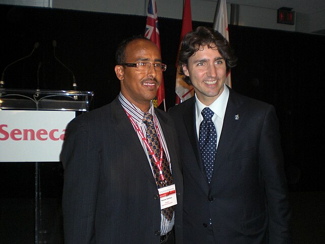 Journalist Hassan Abdillahi of Ogaal Radio with then MP Justin Trudeau at Seneca College (2009).