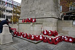 An overview of poppy wreathes laid at the base of the Kingston upon Hull Cenotaph on Remembrance Sunday 2023.