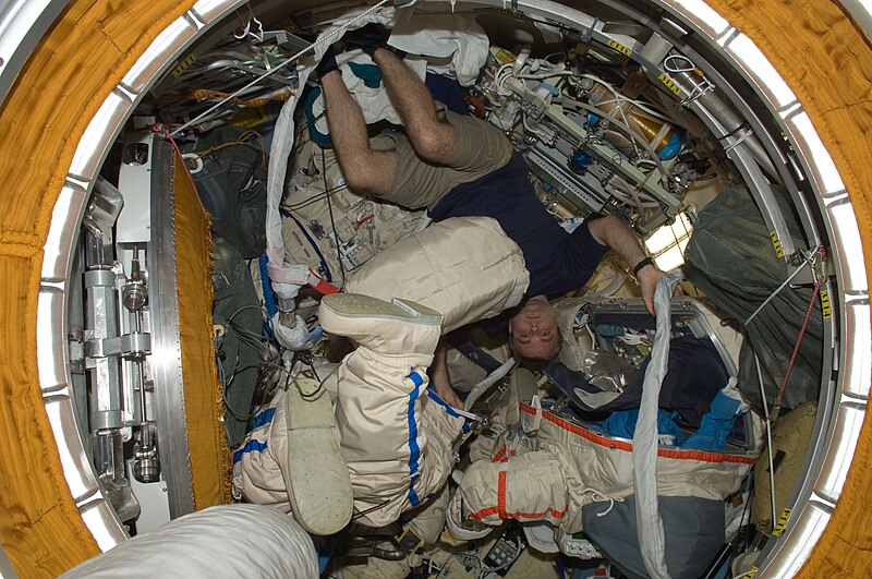 File:ISS-22 Maxim Suraev works with EVA equipment.jpg